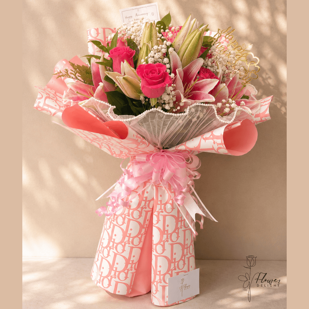 12 Pink Roses and Pink Lilies with Pink Dior Wrapping by Flower Delight