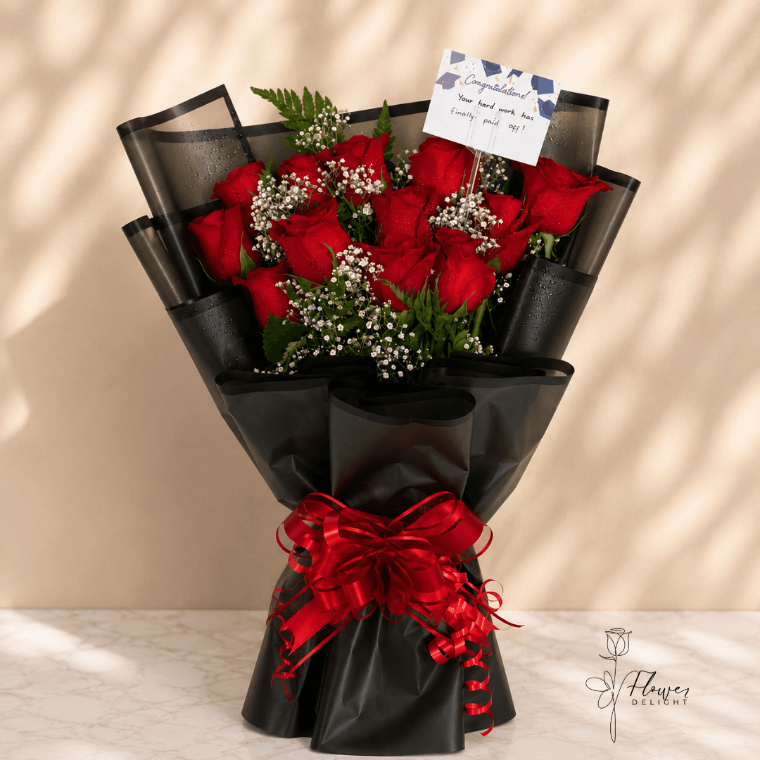 12 Red Roses with Clear Black Wrapping by Flower Delight