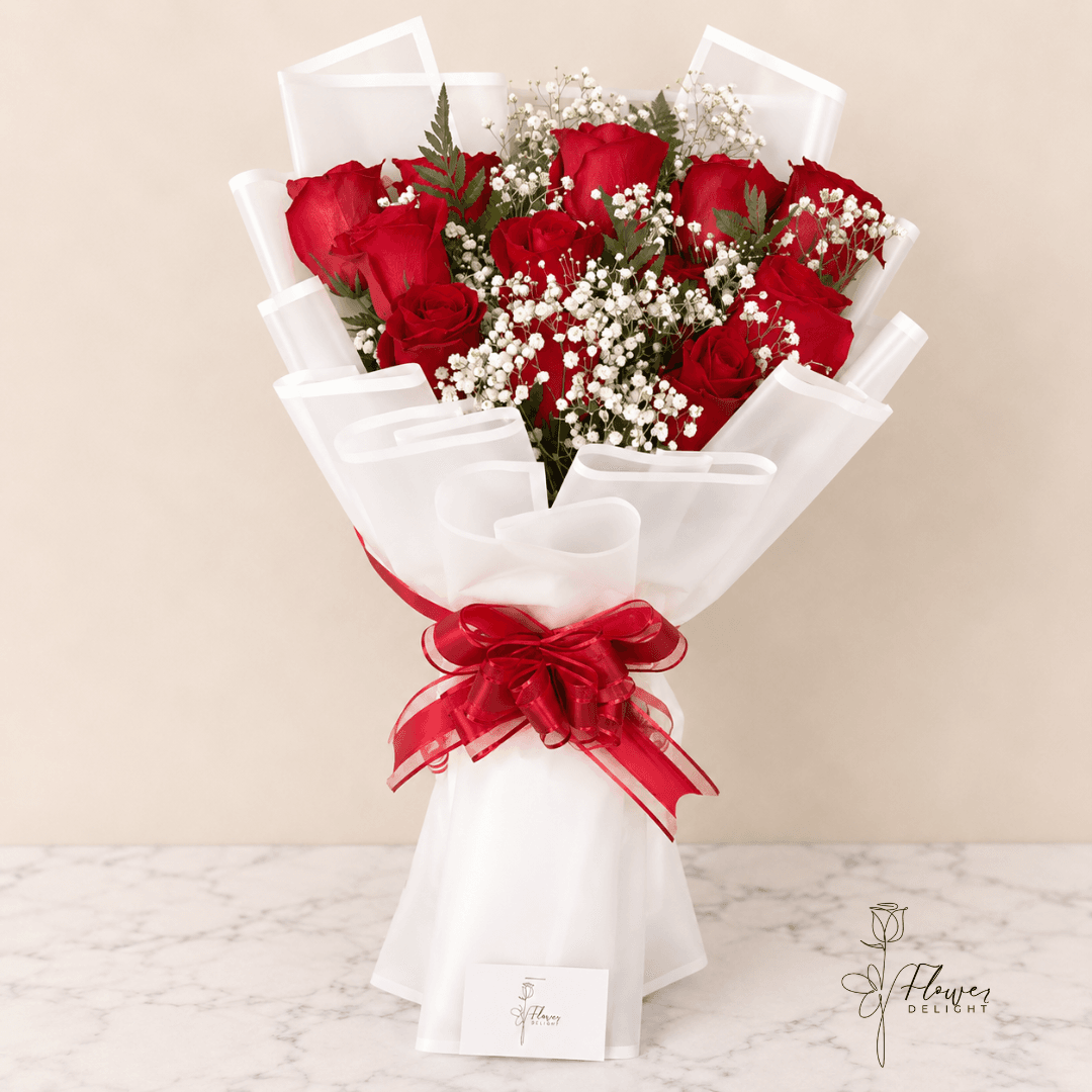 12 Red Roses with Clear White Wrapping by Flower Delight