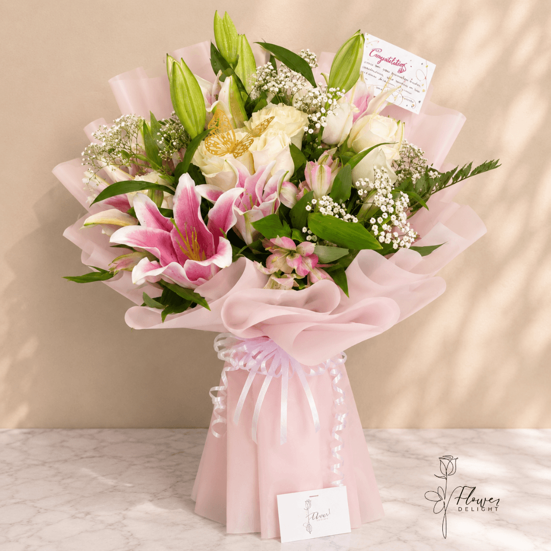 12 White Roses and Pink Lilies with Pink Wrapping by Flower Delight