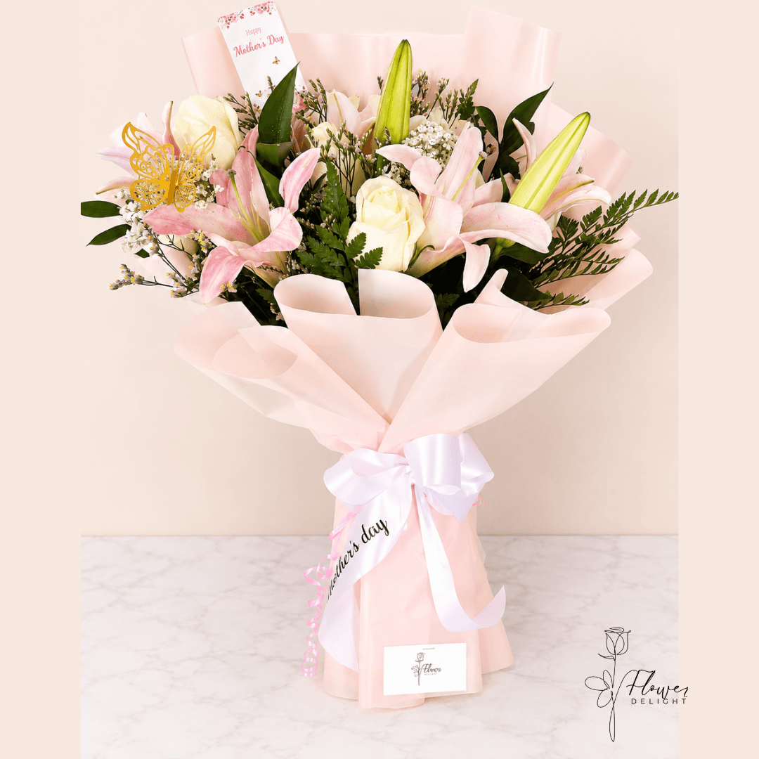 12 White Roses and Light Pink Lilies with Pink Wrapping by Flower Delight