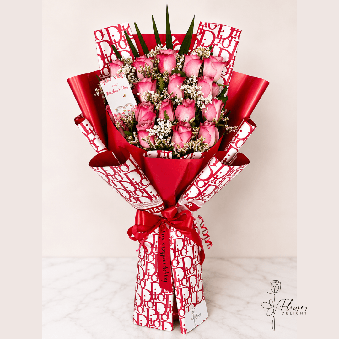 18 Pink Roses with Red Dior Wrapping by Flower Delight