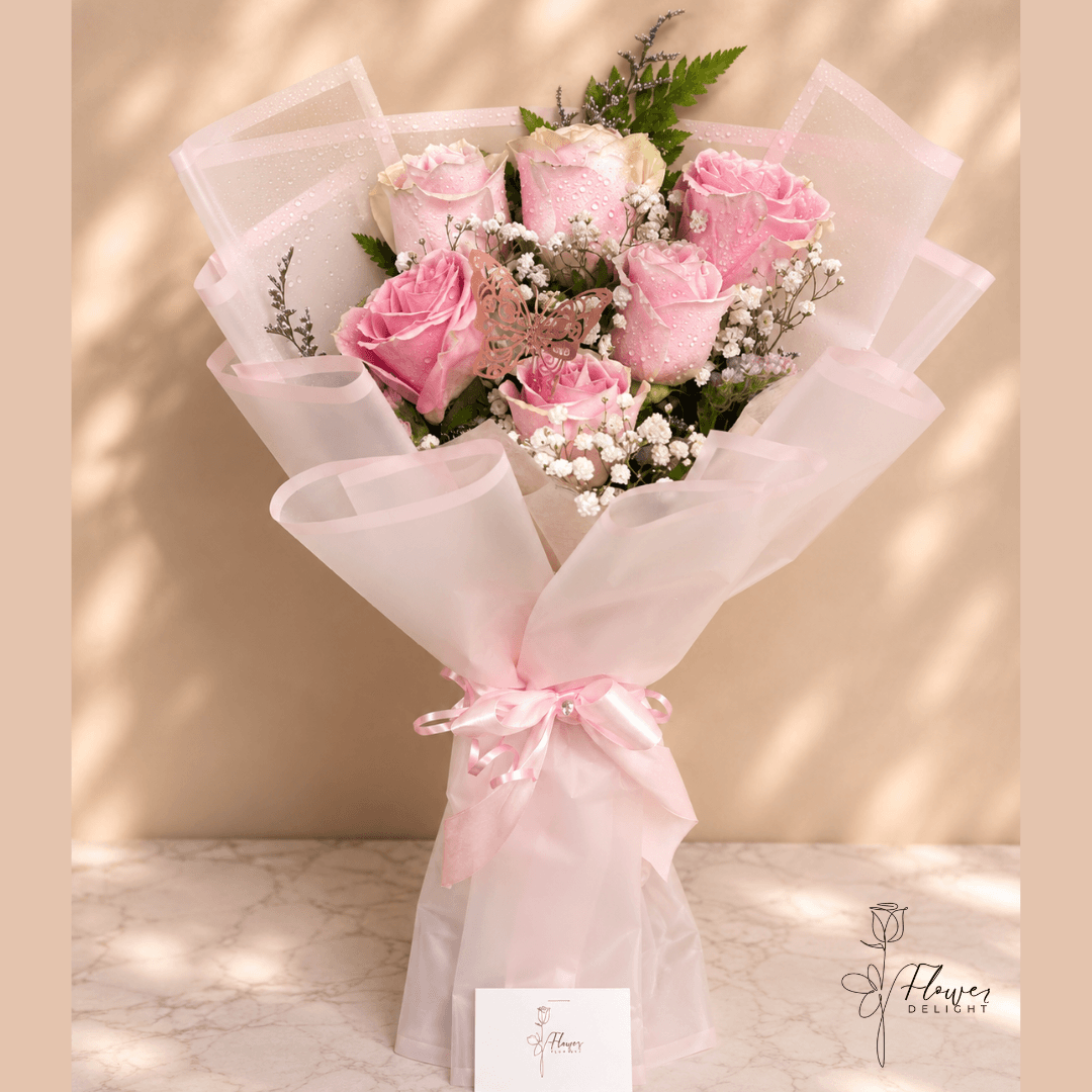 6 Pink Roses with Clear Pink Wrapping by Flower Delight