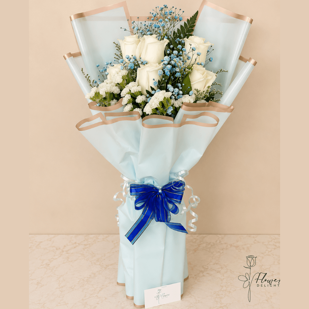 6 White Roses with Blue Wrapping by Flower Delight
