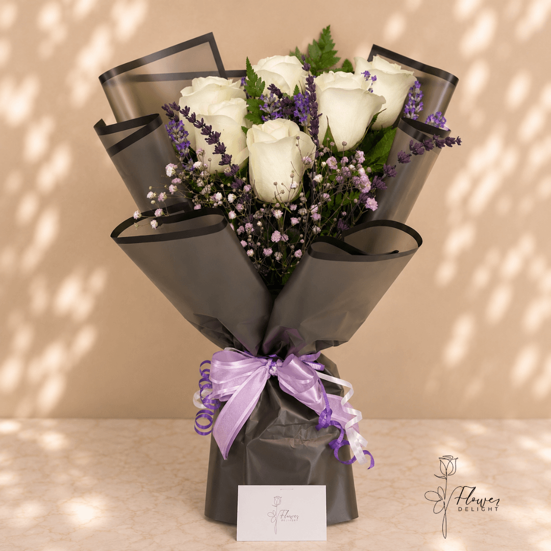 6 White Roses and Lavender with Clear Black Wrapping by Flower Delight