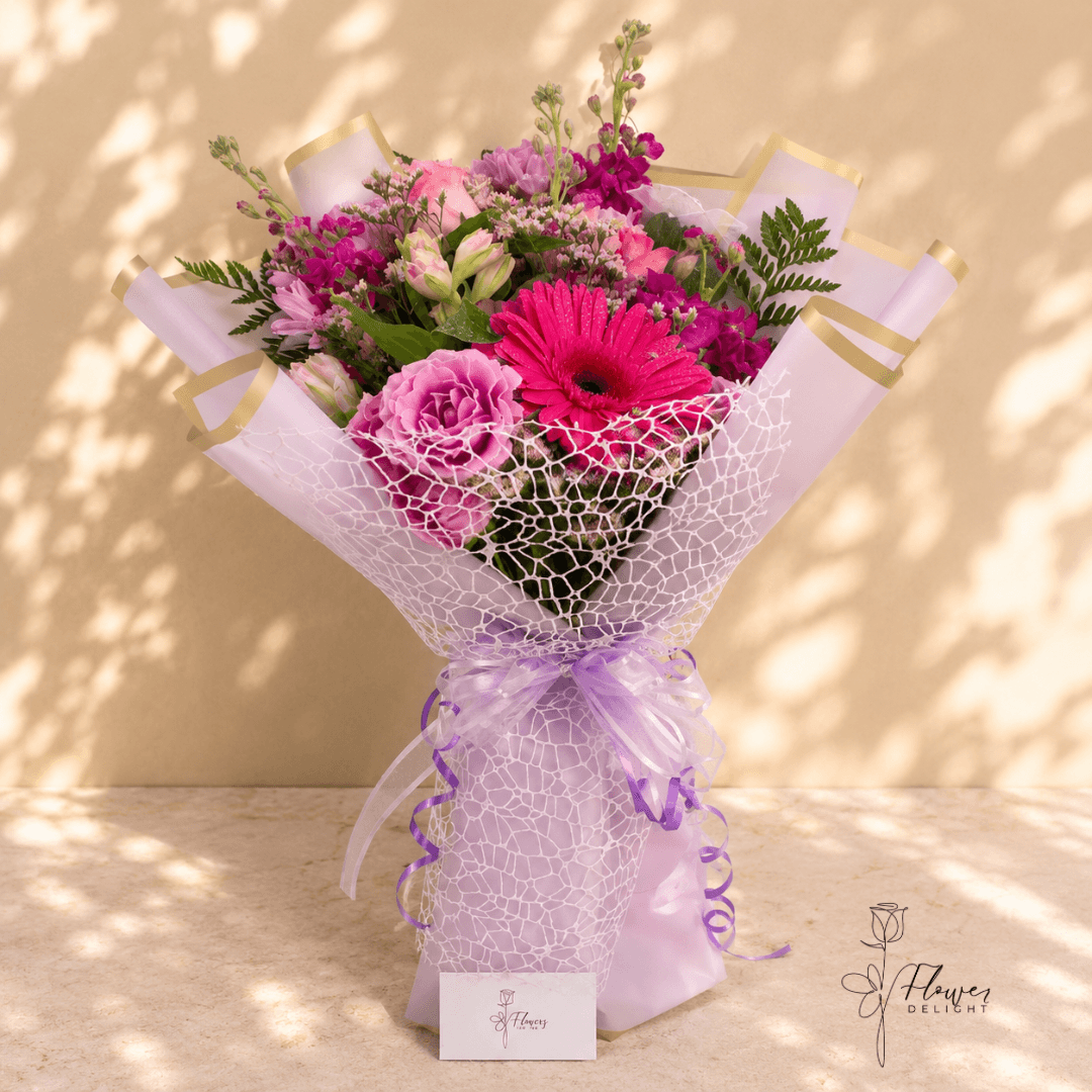 Pink and purple mixed bouquet by Flower Delight
